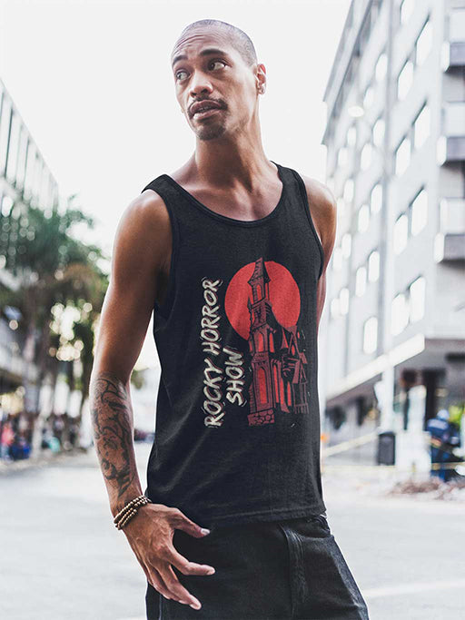 A young man wearing an official Rocky Horror Show Castle Silhouette Adults Vest