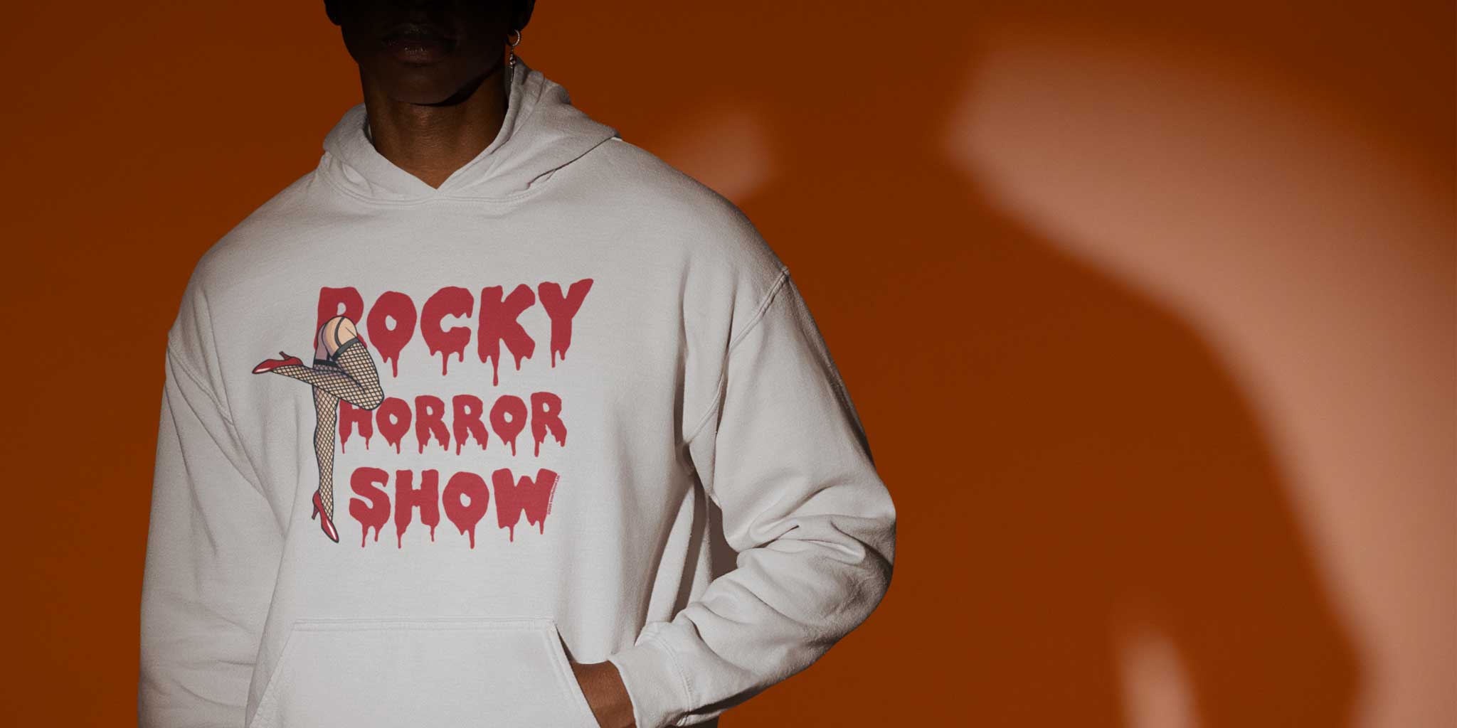 A man wearing a Rocky Horror Show Legs ith Logo Hoodie